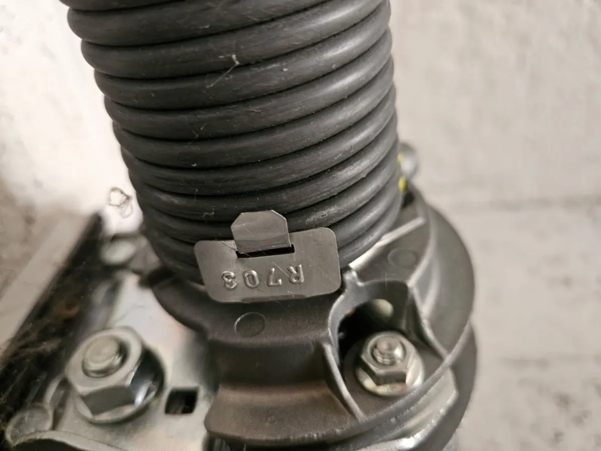 Tambour et bague de réglage d'un ressort de torsion de porte sectionnelle en gros plan